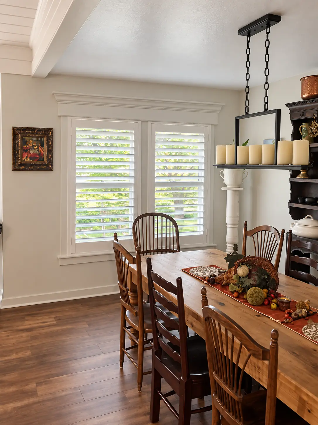 White plantation shutters in a traditional dining room