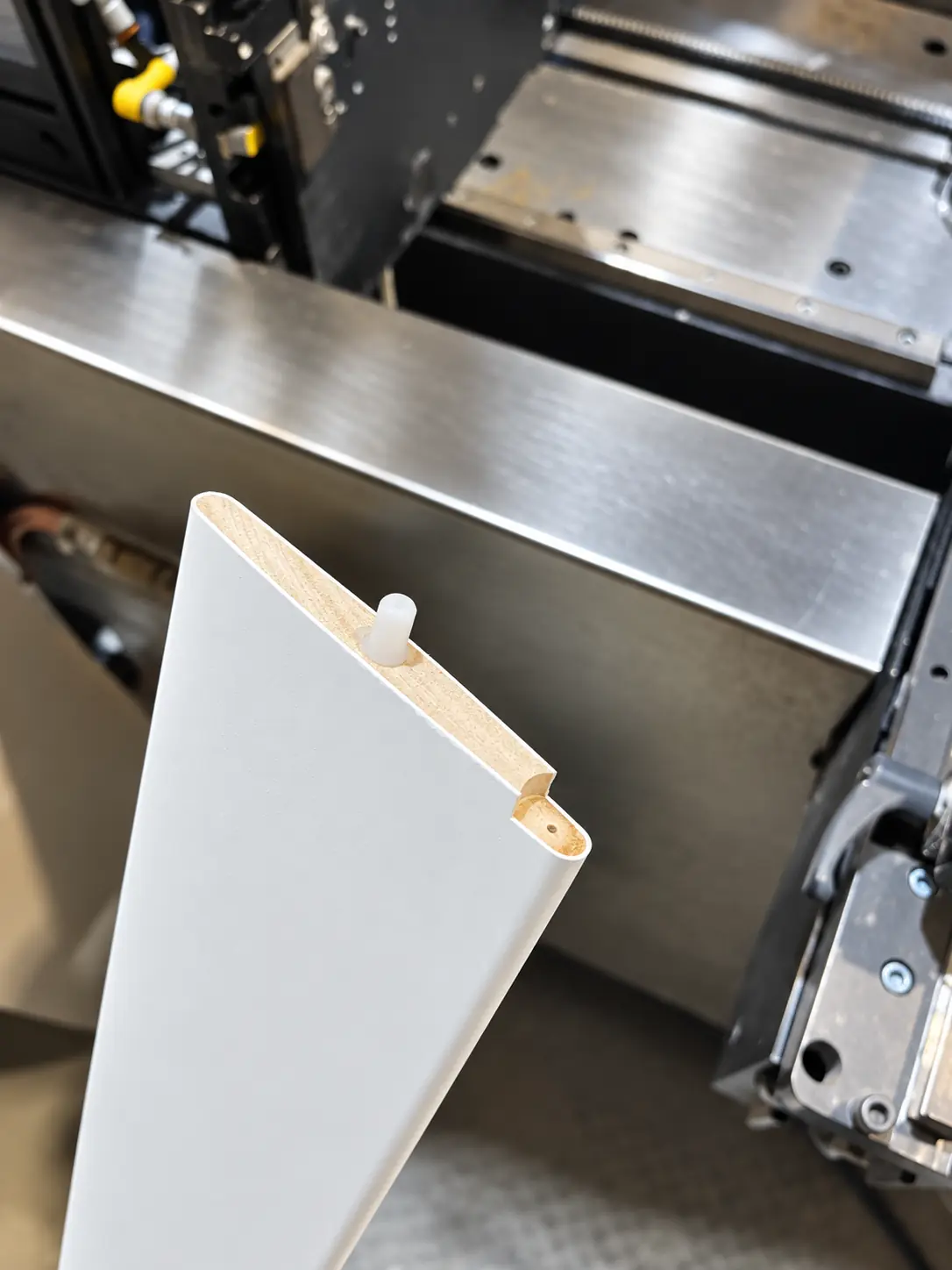 Close view of a precisely positioned shutter louver hole and pin