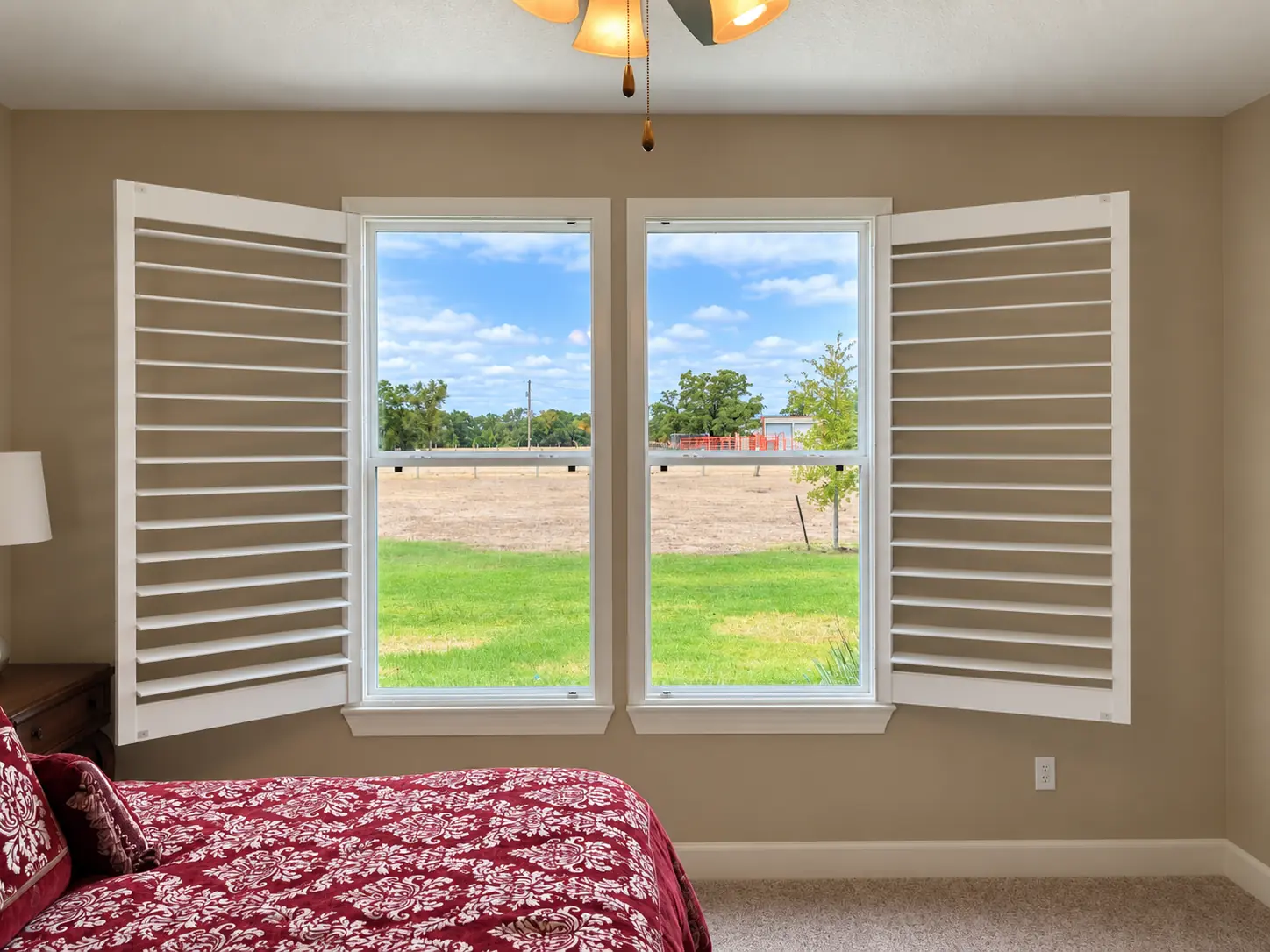 Plantation shutter panels opened to reveal the view